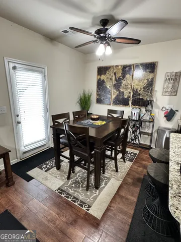 a view of a dining room with furniture window and outside view
