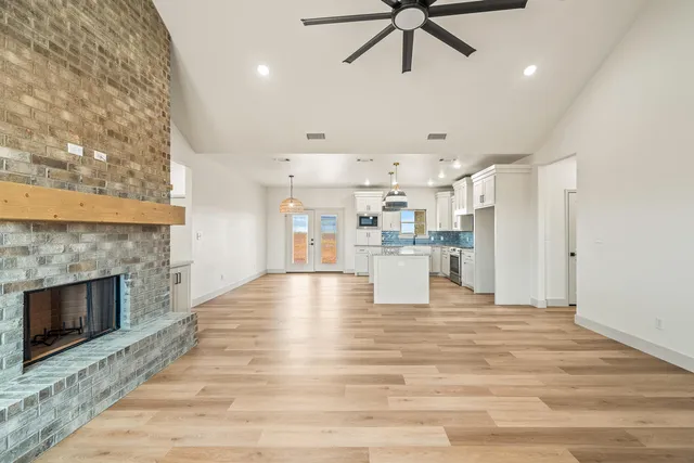 a view of a kitchen with a stove cabinets and wooden floor