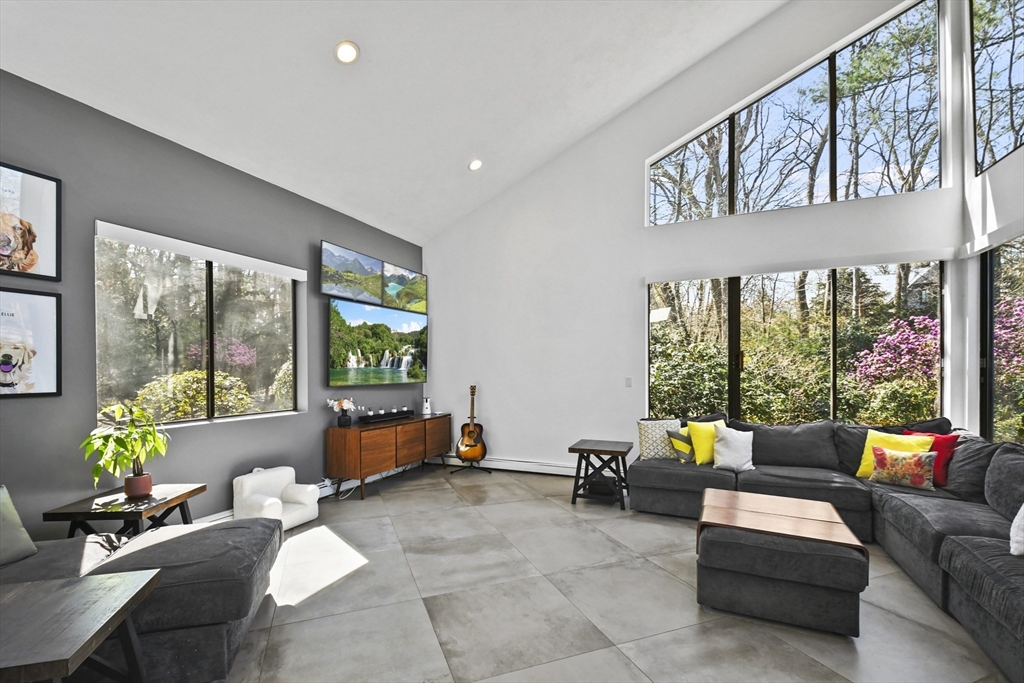 105 Tower Road Lincoln, MA 01773 - Photo 10 of 37 a living room with furniture and floor to ceiling windows