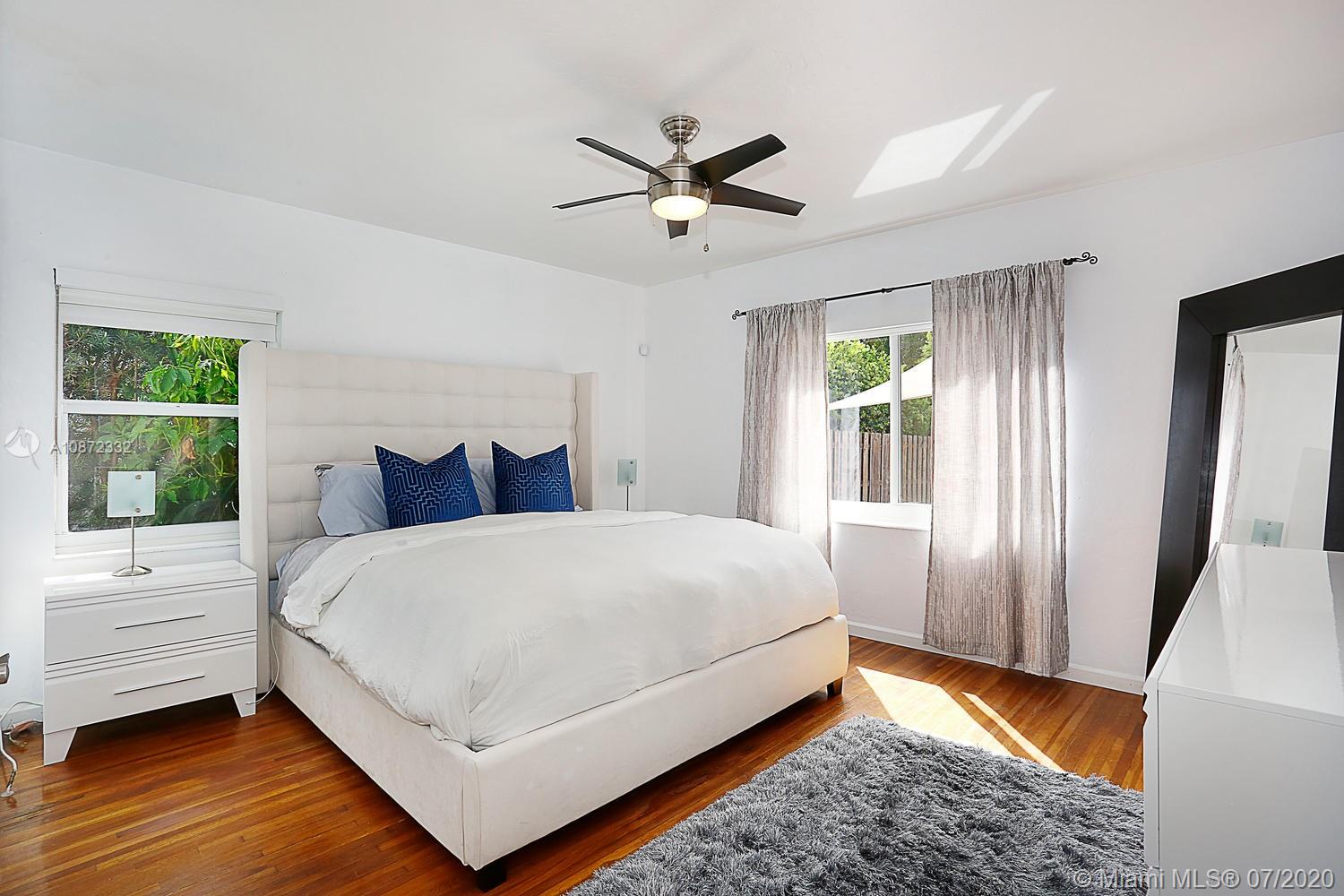 5161 Alton Road Miami Beach, FL 33140 - Photo 15 of 25 a large white bed in a white room