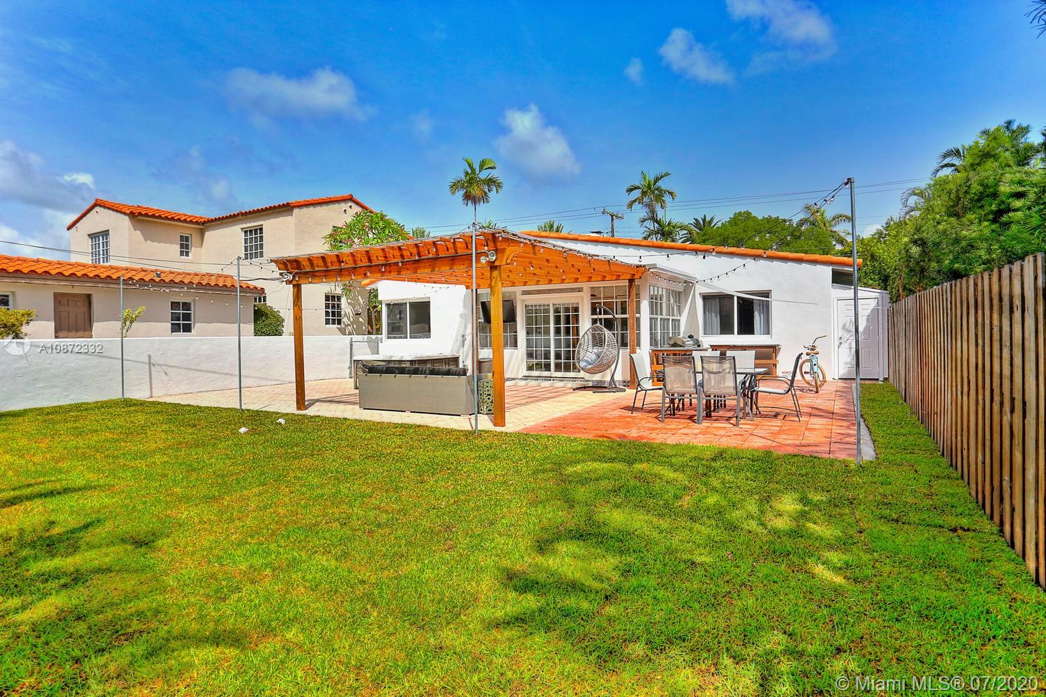 5161 Alton Road Miami Beach, FL 33140 - Photo 25 of 25 a view of a house with pool and chairs