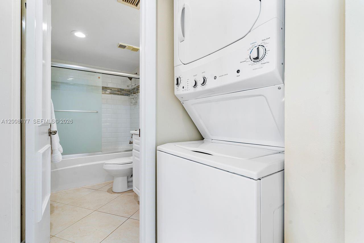 400 Ocean Trail Way, Unit 302 Jupiter, FL 33477 - Photo 21 of 29 a bathroom with a toilet sink and shower