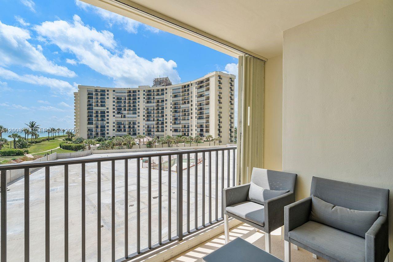 400 Ocean Trail Way, Unit 302 Jupiter, FL 33477 - Photo 23 of 29 a view of a balcony with furniture