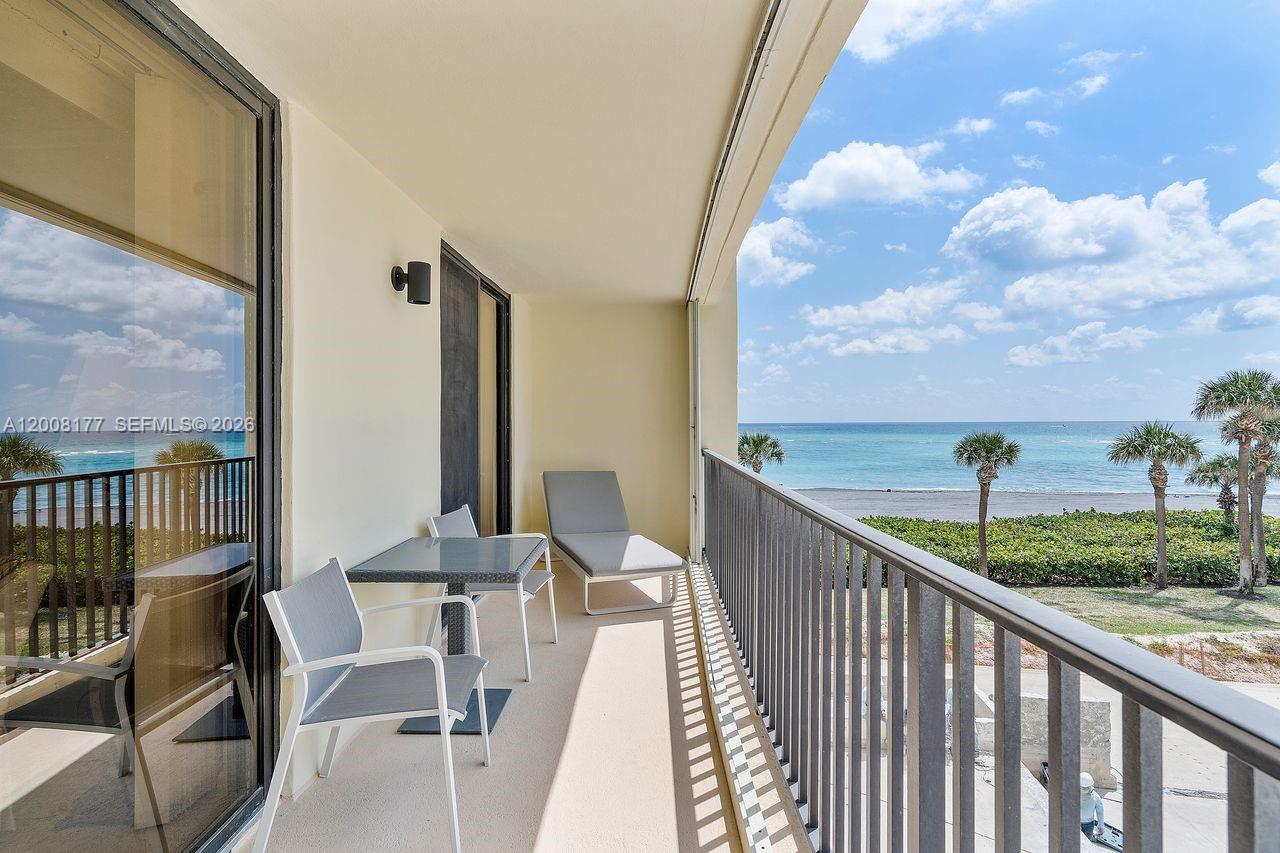 400 Ocean Trail Way, Unit 302 Jupiter, FL 33477 - Photo 24 of 29 a view of a balcony with furniture