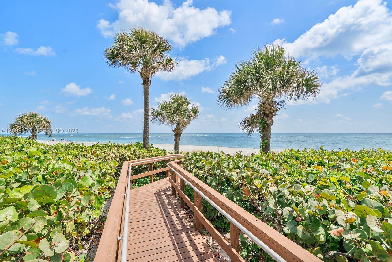 400 Ocean Trail Way, Unit 302 Jupiter, FL 33477 - Photo 28 of 29 a view of a balcony with wooden fence