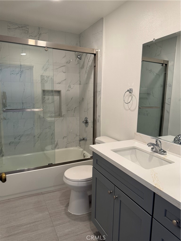 1820 Pepper Street, Unit E Alhambra, CA 91801 - Photo 18 of 30 a bathroom with a sink a toilet and shower