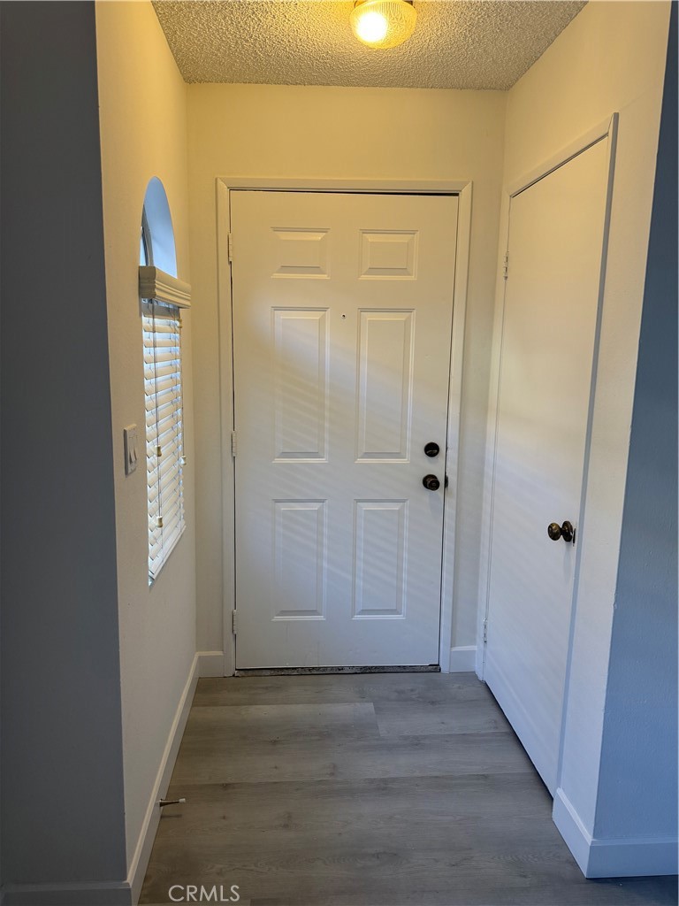 1820 Pepper Street, Unit E Alhambra, CA 91801 - Photo 5 of 30 an empty room with wooden door and mirror