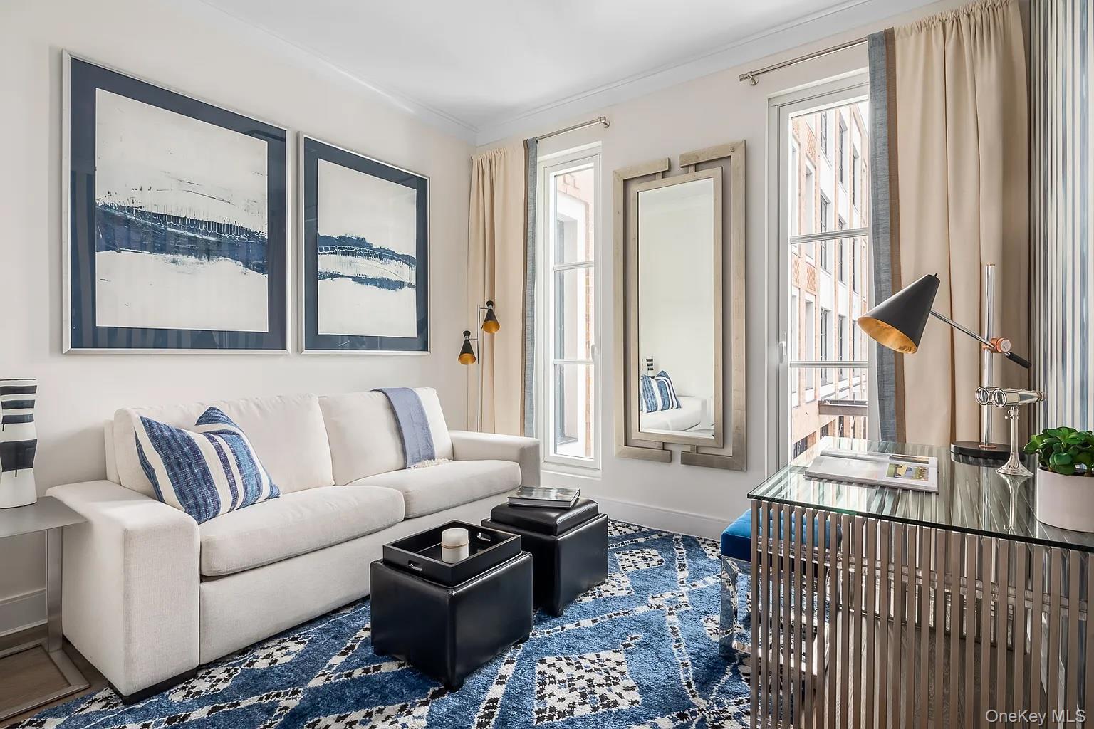 100 Garvies Point Road, Unit 1146 Glen Cove, NY 11542 - Photo 1 of 11 a living room with furniture and a large window