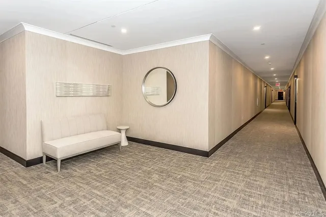 a view of a livingroom with furniture and a window