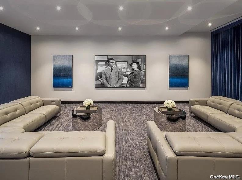 100 Garvies Point Road, Unit 1146 Glen Cove, NY 11542 - Photo 8 of 11 a living room with furniture and wall painting