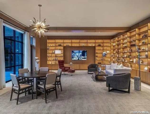 a view of a livingroom with furniture and a chandelier