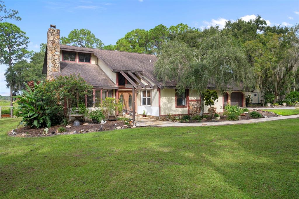 8605 Fussell Drive Wesley Chapel, FL 33545 - Photo 13 of 99 a view of a house with a yard porch and sitting area