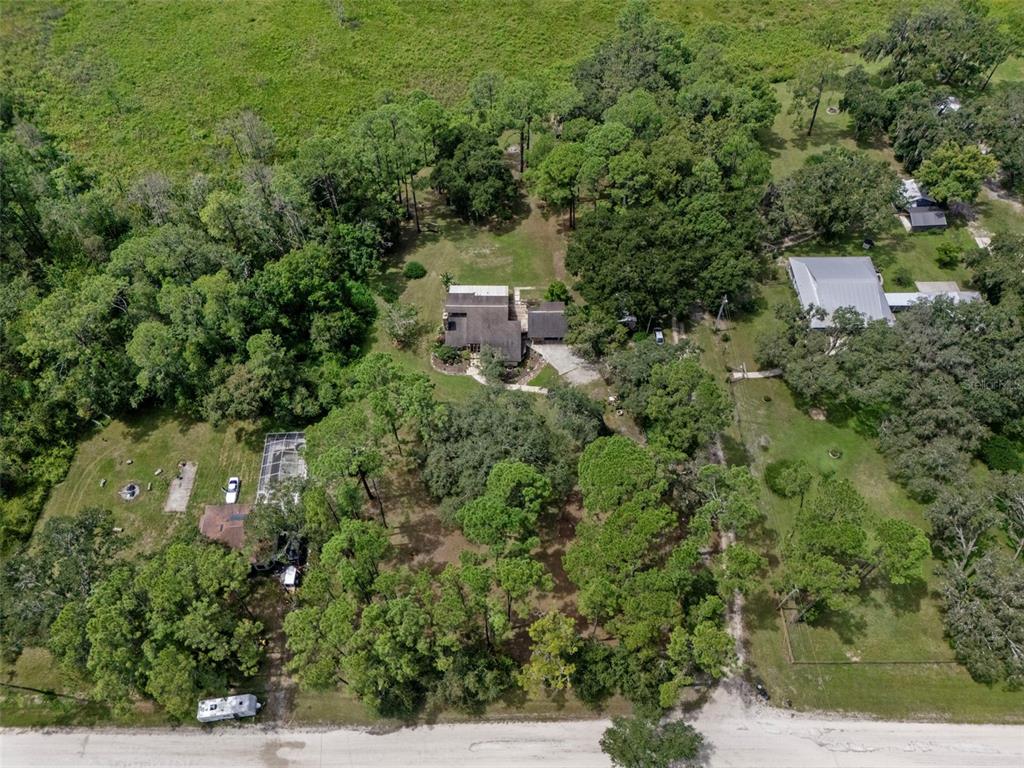 8605 Fussell Drive Wesley Chapel, FL 33545 - Photo 2 of 99 an aerial view of a house with a yard
