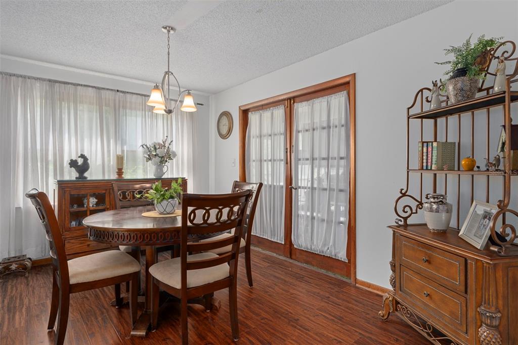 8605 Fussell Drive Wesley Chapel, FL 33545 - Photo 24 of 99 a view of a dining room with furniture window and outside view