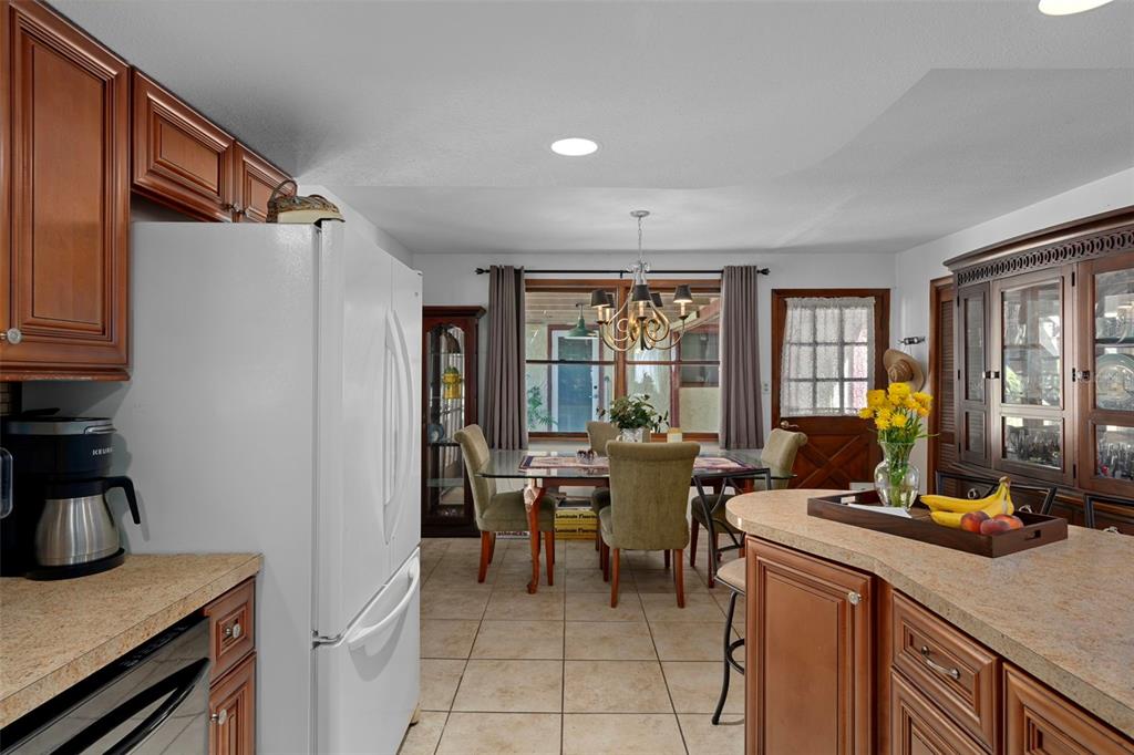 8605 Fussell Drive Wesley Chapel, FL 33545 - Photo 29 of 99 a view of a dining room with furniture window and outside view