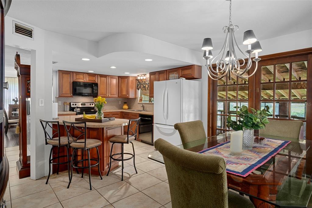 8605 Fussell Drive Wesley Chapel, FL 33545 - Photo 34 of 99 a view of a dining room with furniture