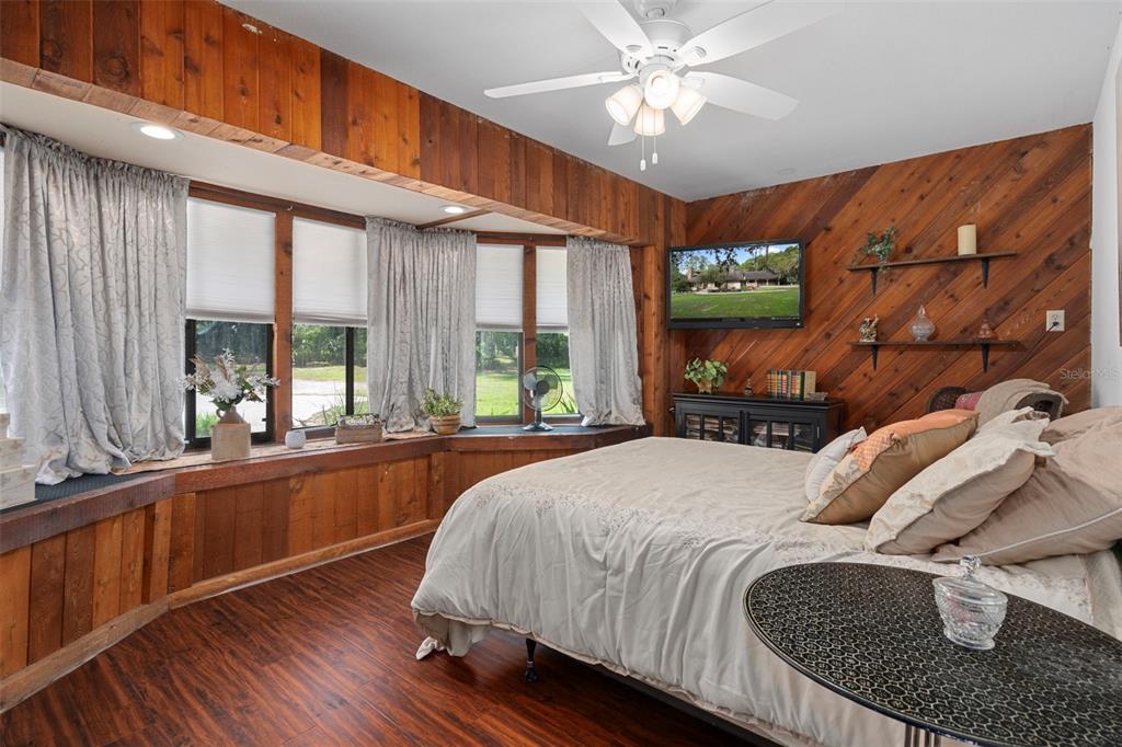 8605 Fussell Drive Wesley Chapel, FL 33545 - Photo 36 of 99 a bed sitting in a bedroom next to a window