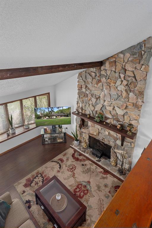 8605 Fussell Drive Wesley Chapel, FL 33545 - Photo 44 of 99 a living room with furniture and a wooden floor