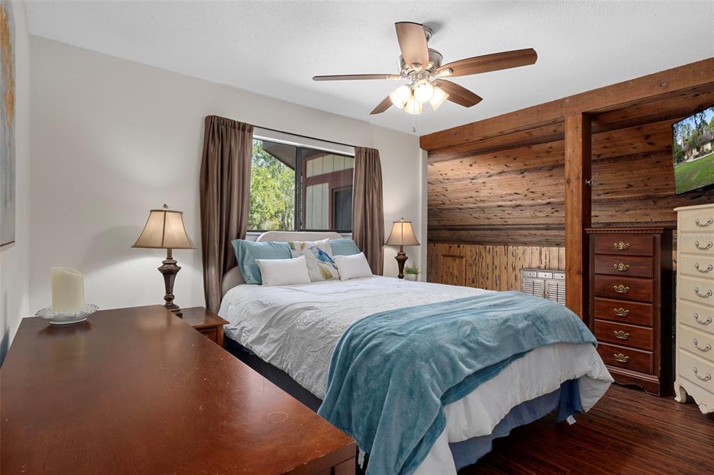 8605 Fussell Drive Wesley Chapel, FL 33545 - Photo 51 of 99 a bedroom with a large bed closet and a large window