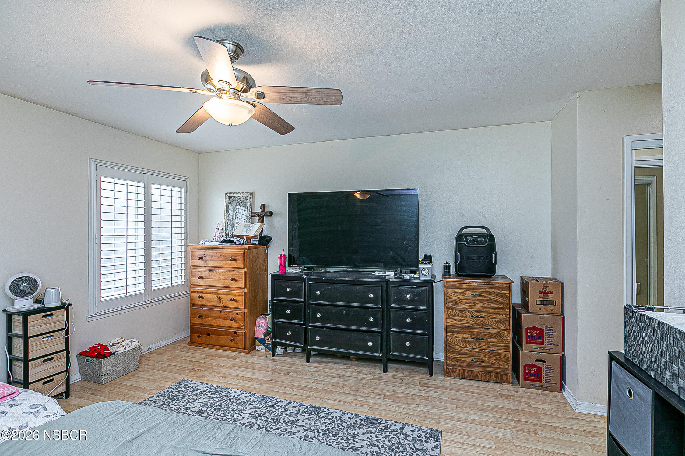 712 Pebble Beach Place Santa Maria, CA 93454 - Photo 27 of 31 a room with furniture and a flat screen tv