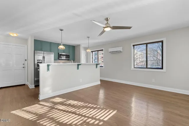 a view of kitchen with wooden floor and window
