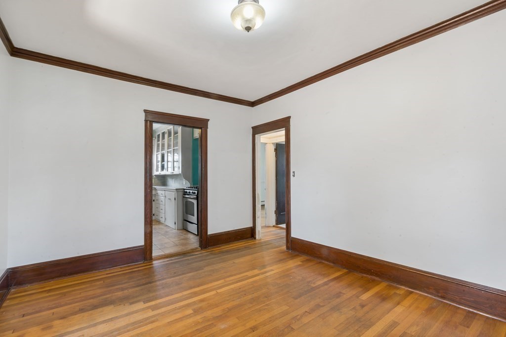 34 Harding Street Fall River, MA 02720 - Photo 15 of 32 a view of an empty room with wooden floor