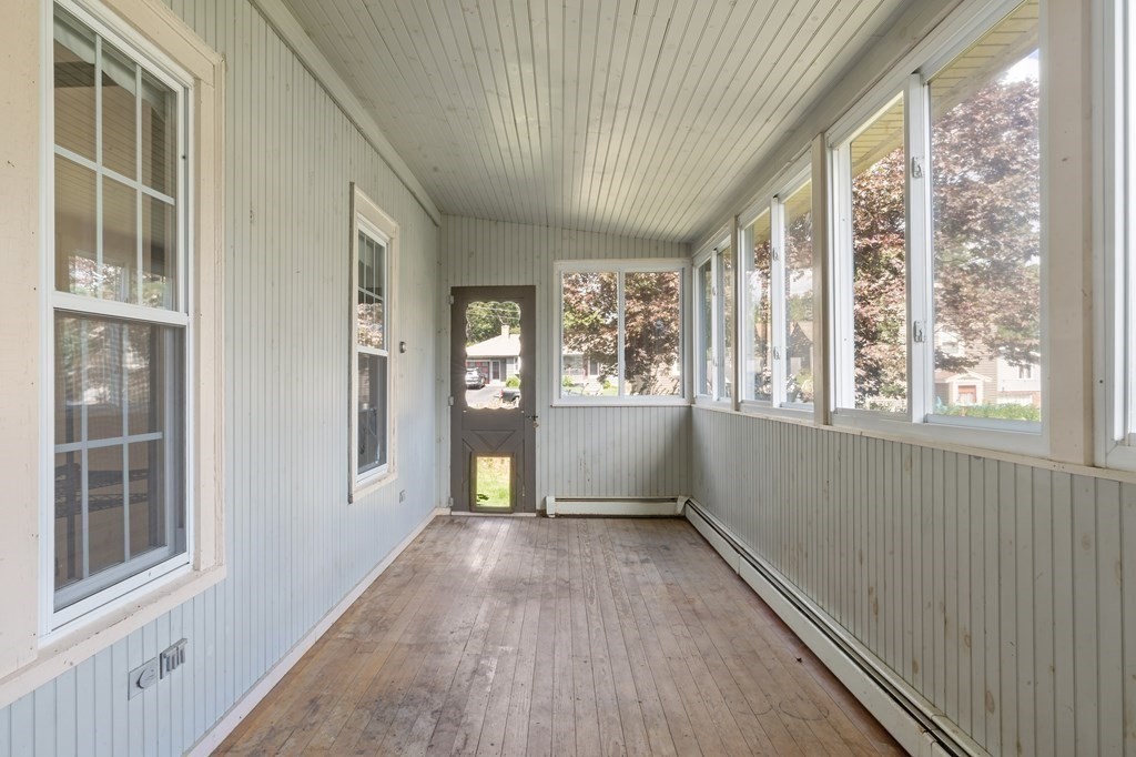 34 Harding Street Fall River, MA 02720 - Photo 17 of 32 a view of an empty room with a window and wooden floor