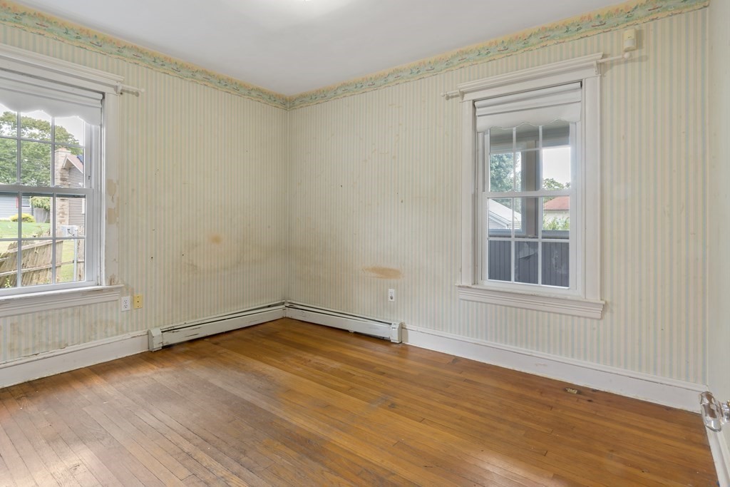 34 Harding Street Fall River, MA 02720 - Photo 21 of 32 an empty room with wooden floor and windows