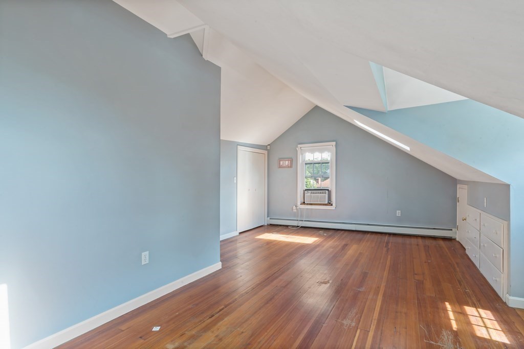 34 Harding Street Fall River, MA 02720 - Photo 22 of 32 a view of an empty room with wooden floor and a window