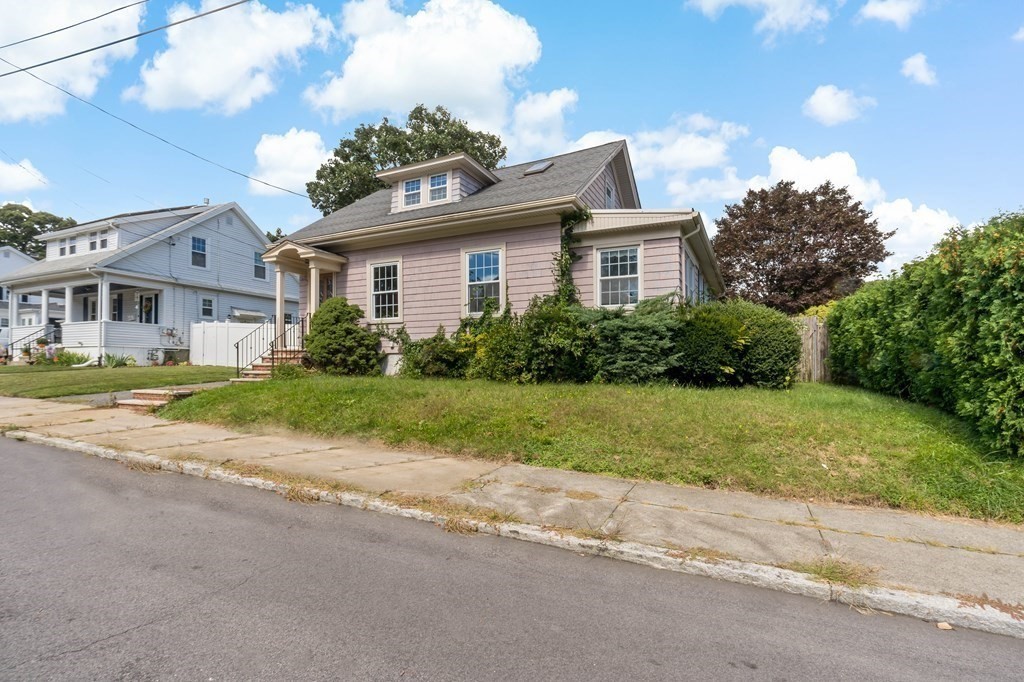 34 Harding Street Fall River, MA 02720 - Photo 32 of 32 a front view of house with yard and green space
