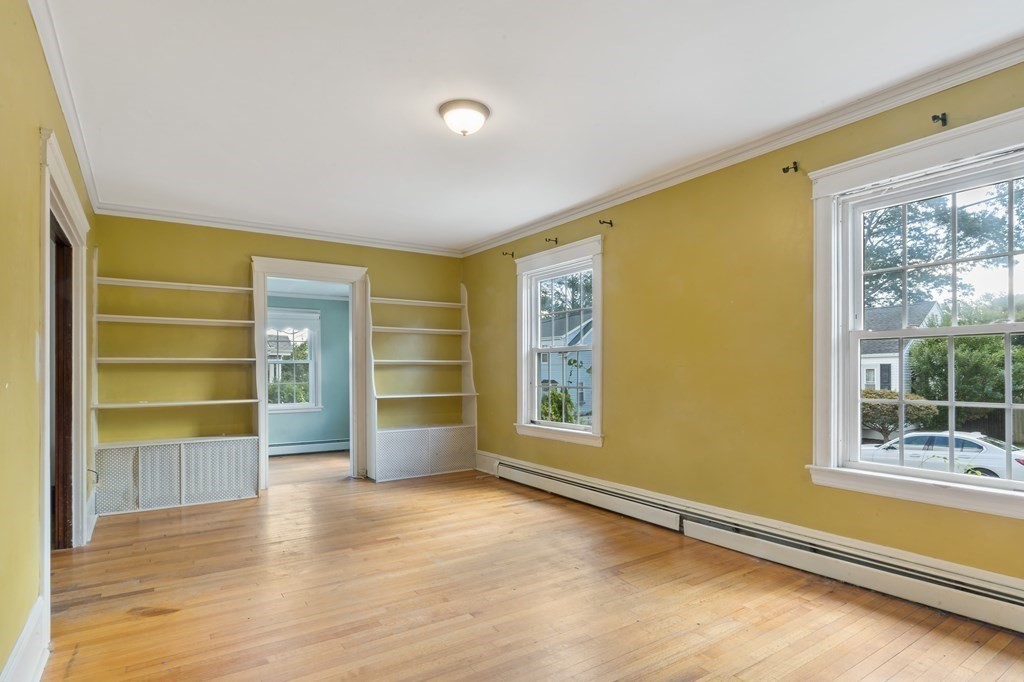 34 Harding Street Fall River, MA 02720 - Photo 5 of 32 a view of an empty room with a window and wooden floor