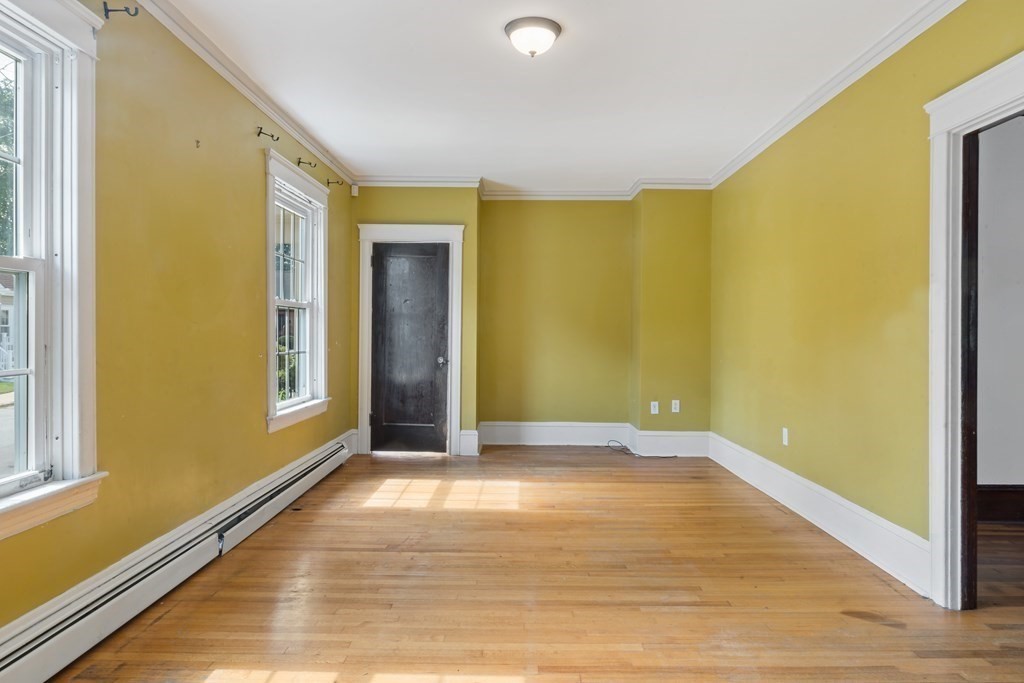 34 Harding Street Fall River, MA 02720 - Photo 6 of 32 a view of an empty room with window and wooden floor