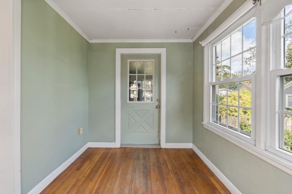 34 Harding Street Fall River, MA 02720 - Photo 8 of 32 an empty room with wooden floor and windows