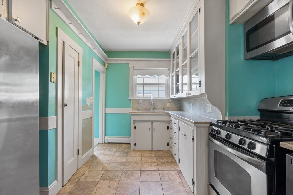 34 Harding Street Fall River, MA 02720 - Photo 10 of 32 a kitchen with a stove and a sink