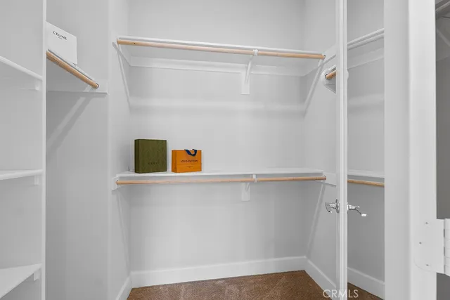 a view of a hallway with washer and dryer