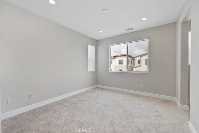 a close view of a utility room with dryer and washer
