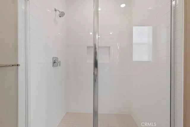 a bathroom with a granite countertop sink a toilet and a large mirror