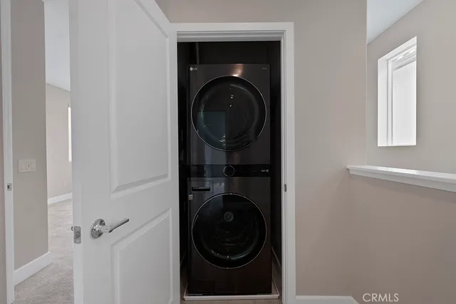 a spacious bedroom with a bed and a window