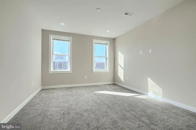 an empty room with windows