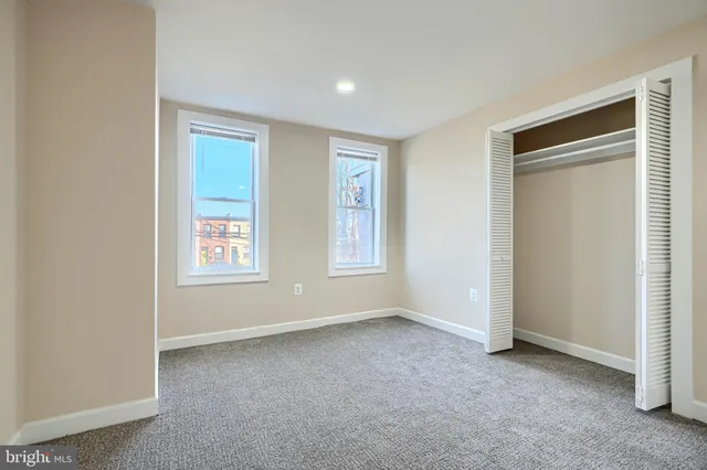 a view of an empty room and a window