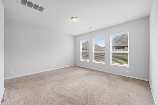 a bathroom with a double vanity sink a mirror and a bathtub