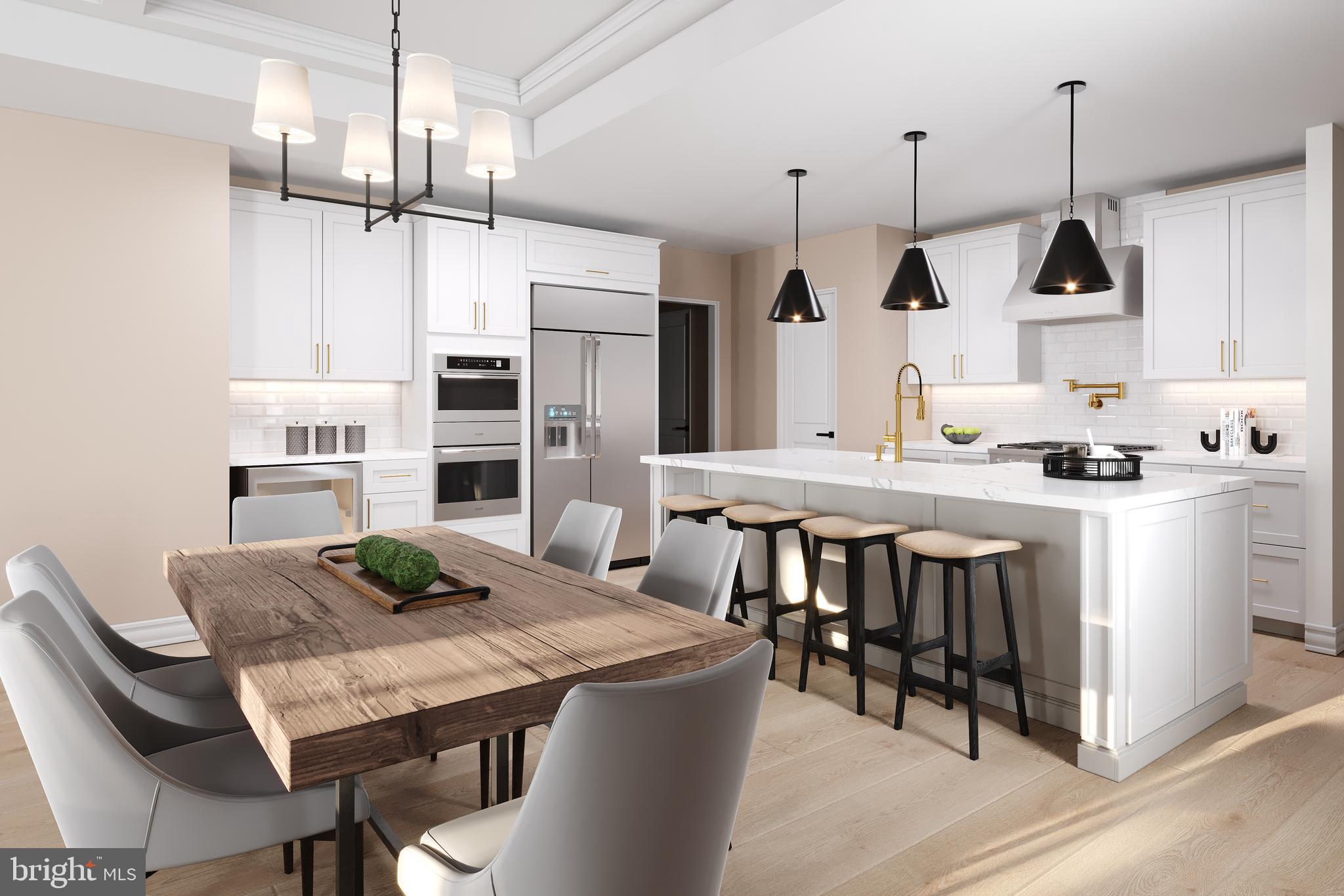 6 Blazing Star Street Frederick, MD 21702 - Photo 2 of 10 a kitchen with stainless steel appliances kitchen island a table chairs in it and wooden floors