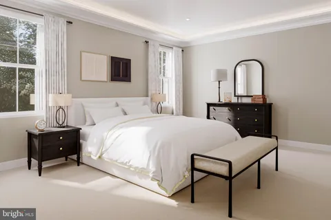 a bedroom with a bed and a dresser next to a window