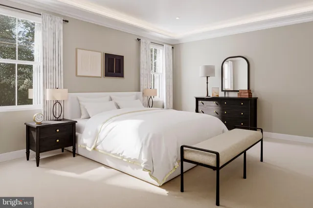 a bedroom with a bed and a dresser next to a window