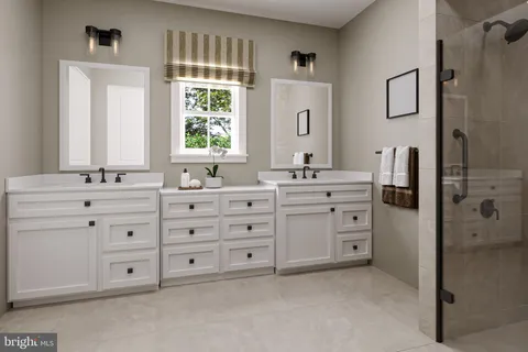 a bathroom with a double vanity sink a mirror and a bathtub