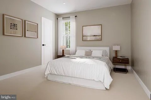 a bedroom with a bed and painting on the wall