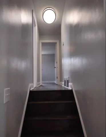 a bathroom with a toilet sink and window