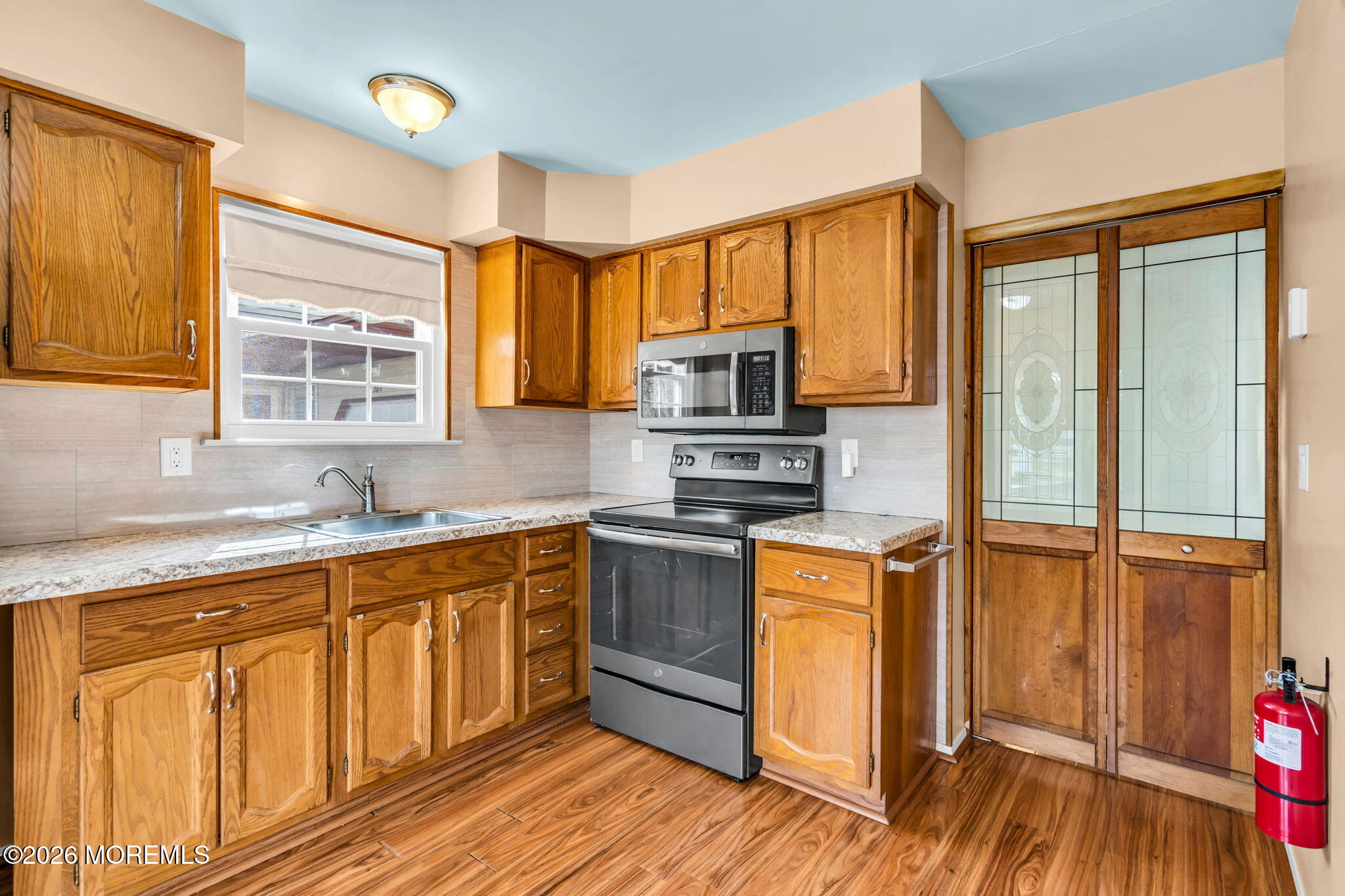 20B Amesbury Road, Unit B Whiting, NJ 08759 - Photo 10 of 25 a kitchen with stainless steel appliances granite countertop a stove a sink and a refrigerator