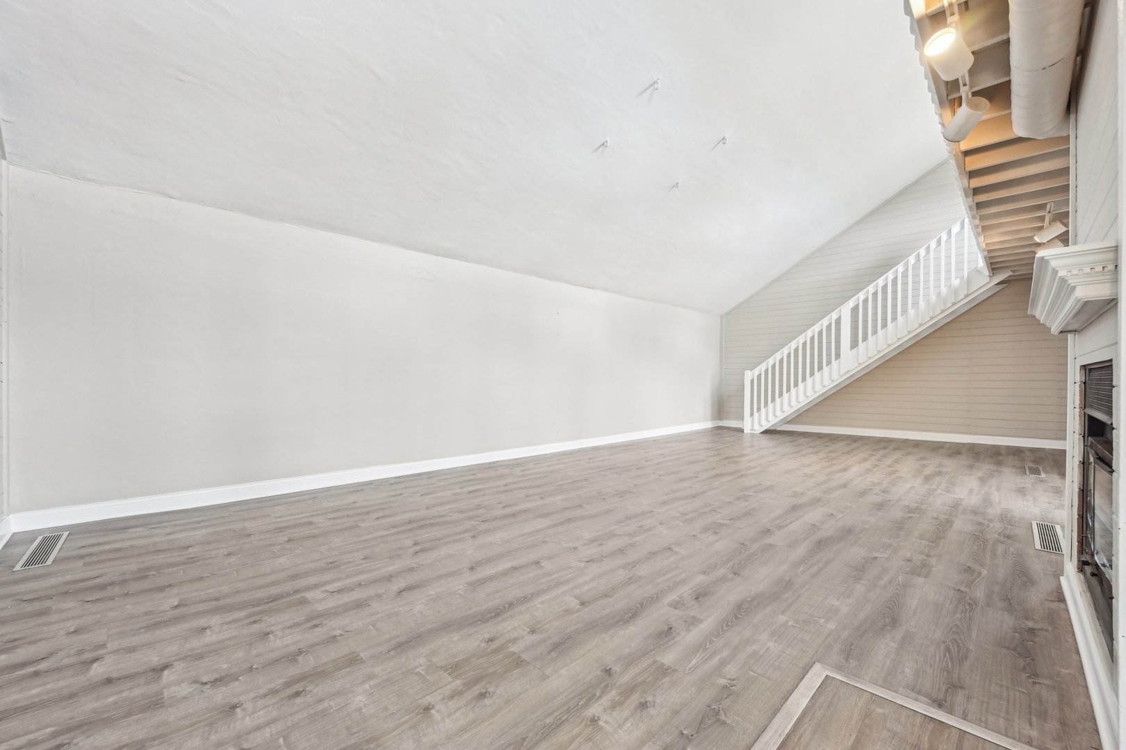 1406 Busse Road Marengo, IL 60152 - Photo 14 of 76 a view of an empty room with wooden floor and a window
