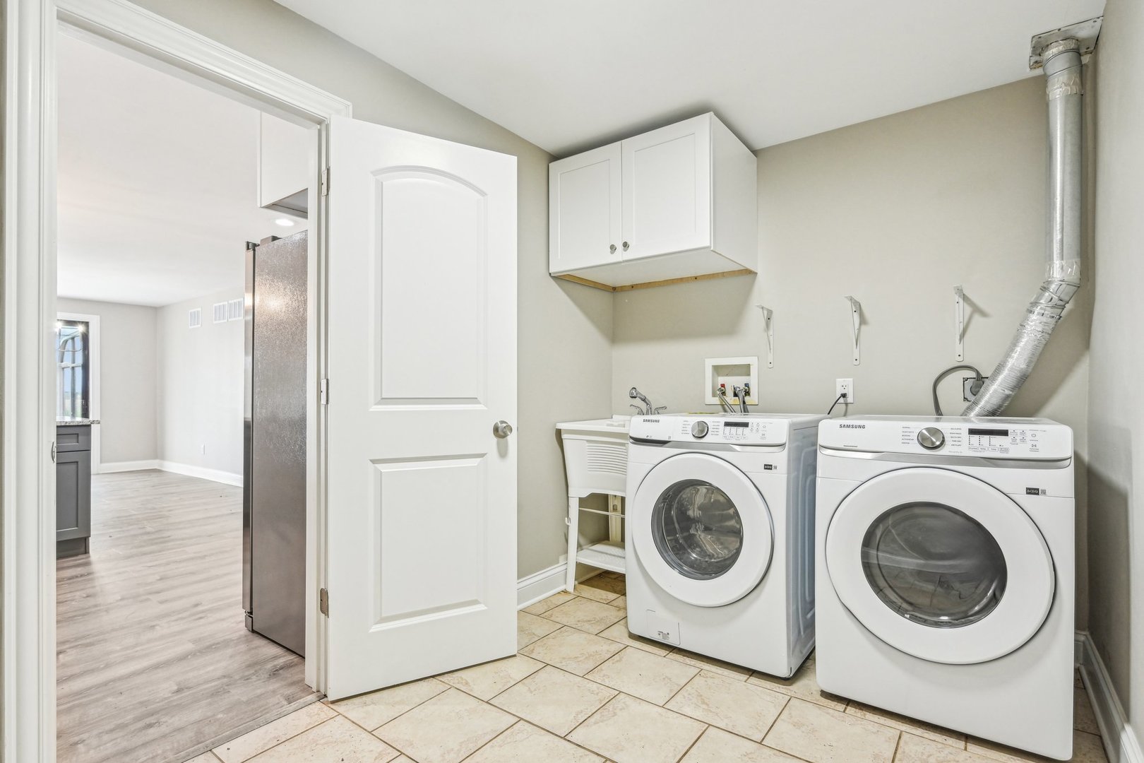 1406 Busse Road Marengo, IL 60152 - Photo 21 of 76 a view of a kitchen with refrigerator and washer
